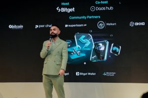 Archival photograph of a speaker at a Bitget Crypto Experience Month event, separate from the theft