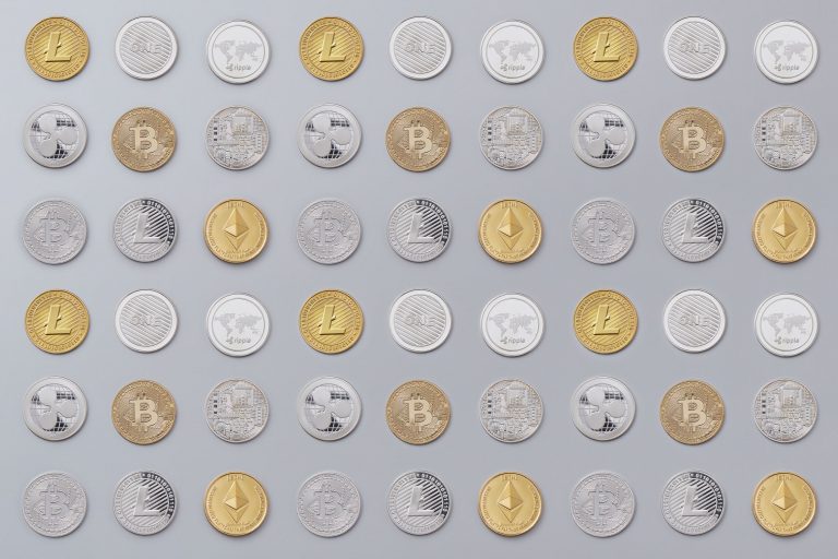 A seamless pattern of various cryptocurrency coins in gold and silver tones
