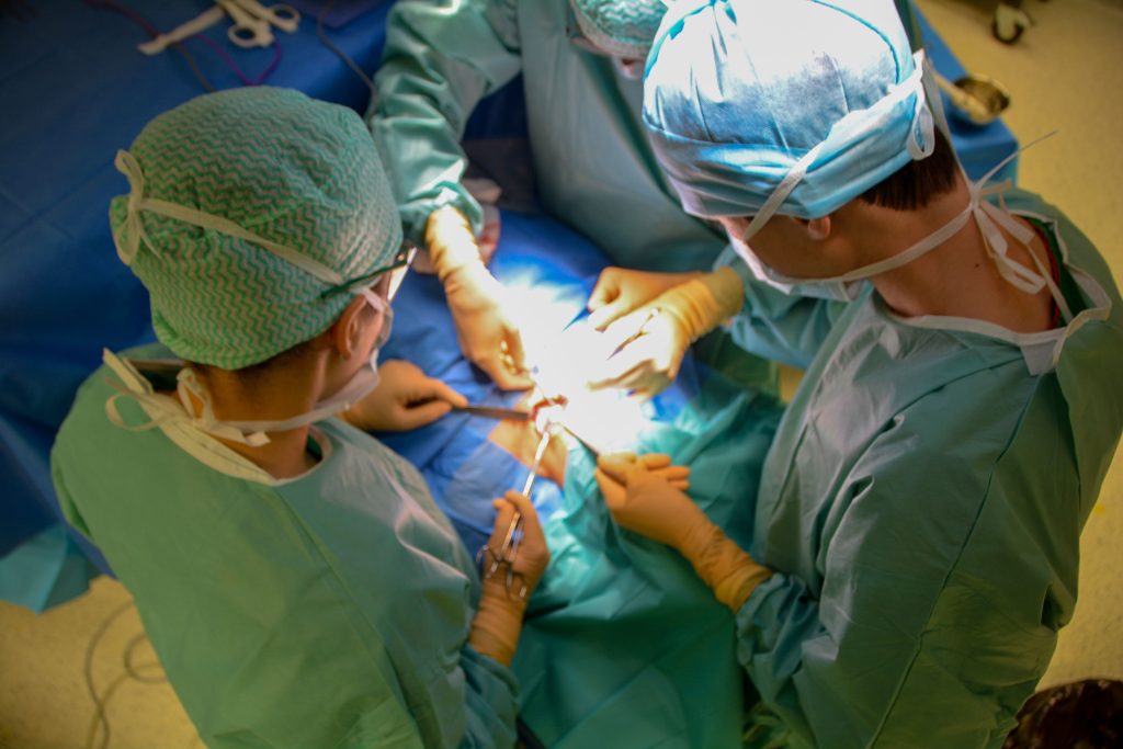 A surgical team works in an operating room